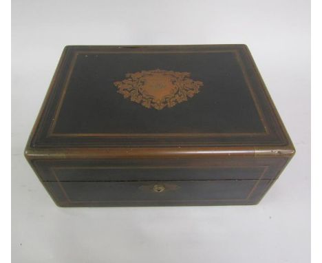 A Victorian ebonised travelling box, brass line inlaid with side flush fitting carrying handles.  The box fitted with five cu