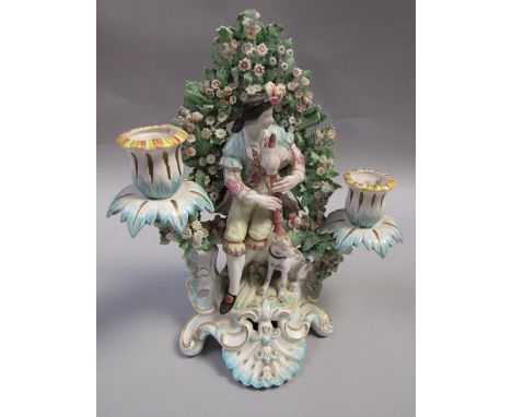 A patch marked Derby bocage candlestick figure of the Piping shepherd with his dog, a/f, 27cm h. 
