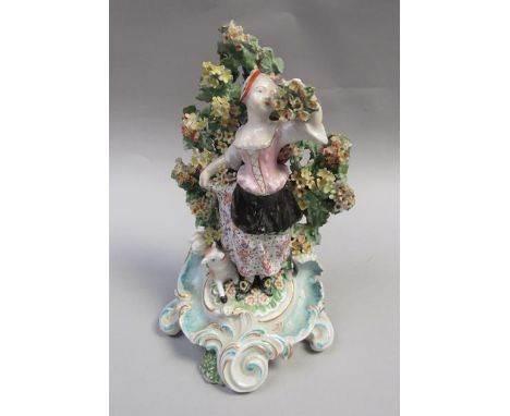 A Derby patch marked bocage figure of a shepherdess with lamb, supported on a scroll base, a/f, 22cm h. 