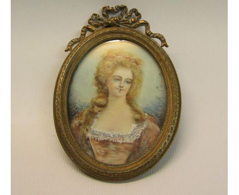 R Cauier - 19c oval portrait miniature of a lady, on ivory, brass framed, 7cm x 5.5cm. 