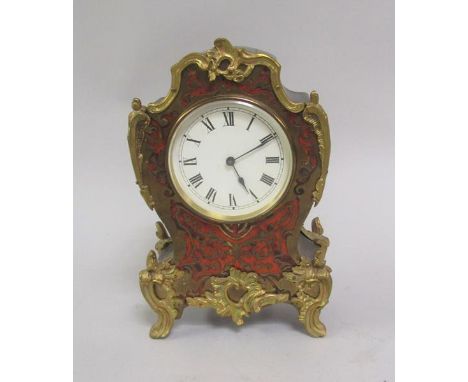 A late 19c/early 20c French style mantel clock, black lacquered and with red boullework face, having ormolu mounts.  The move
