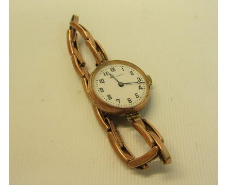 A 9ct Gold vintage ladies watch on 9ct gold stretch bracelet strap 