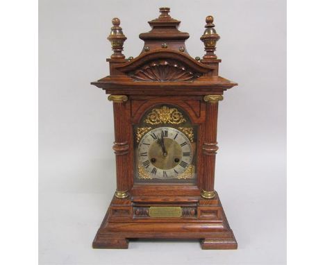A late Victorian chiming mantel clock for Junghans movement with brass and silvered arched dial, gilt metal spandrels within 