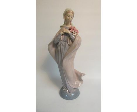 A Lladro porcelain figurine - Madonna with flowers, model no.5171, 33cm h. 