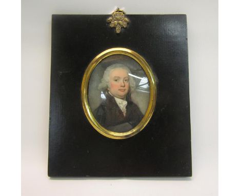 An early 19c oval portrait miniature on ivory of a gentleman, framed, 7cm x 5.5cm. 