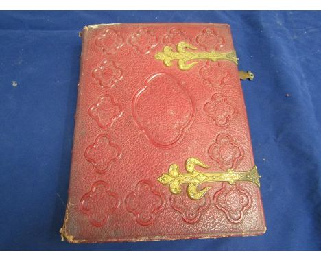 A Victorian photograph album with twenty four double sided pages, each containing four portrait frames.  The first two pages 
