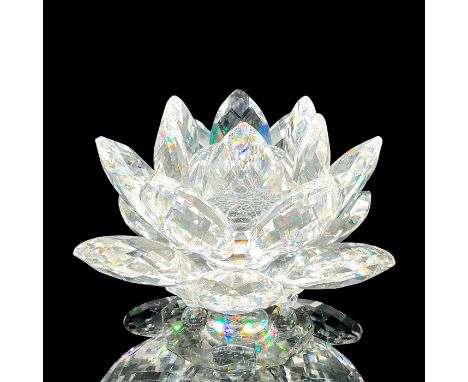 Small elegant clear crystal candle holder in the shape of a multi-pedal waterlily with crystal ball feet. Swarovski etched ba