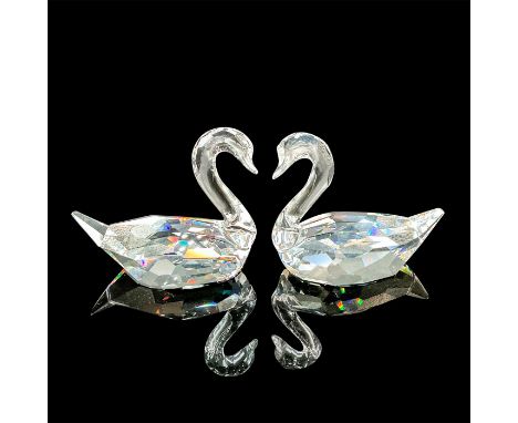 Translucent faceted bodies with clear unfaceted necks and heads.Swarovski acid backstamp. This item has its original box: 8in