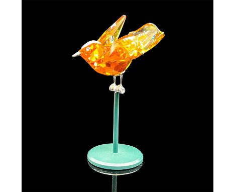 Part of the Tropical Birds and Parrots series. Lead crystal bird made from orange crystal with sterling silver accents, comes