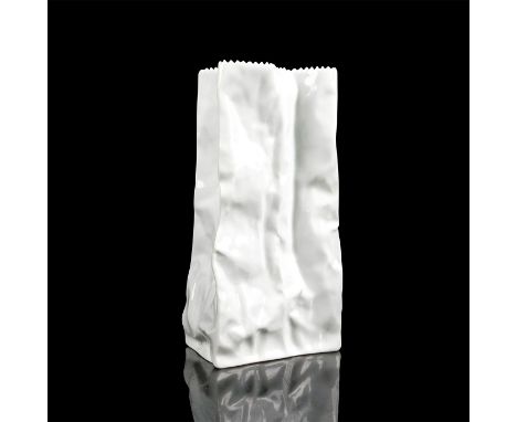 Glazed white porcelain vase shaped as a paper bag. Marked Rosenthal Germany on the bottom. Dimensions: 8.75"H x 4.5"L x 3"WCo