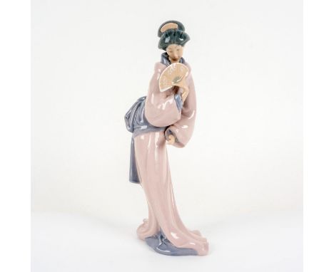 Beautiful Japanese Lady Holding a Fan in Her Hand. Nao by Lladro backstamp. Issued: 1980Dimensions: 13"H x 6"L x 3"WCountry o