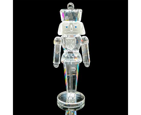 Part of the Exquisite Accents collection. Features a lead crystal nutcracker standing to attention with blue crystal eyes, fr