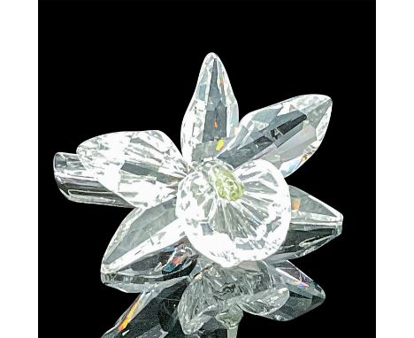 A single stunning blossomed orchid in clear faceted crystal with a pale yellow center. Swarovski acid mark. This item has its