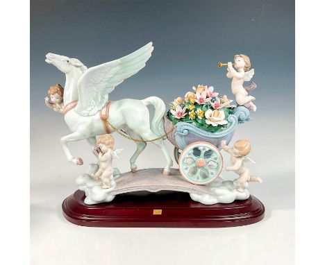 Glossy finish; Modeled as a winged horse pulling a finely decorated carriage with flowers and flying cherubs. Lladro backstam