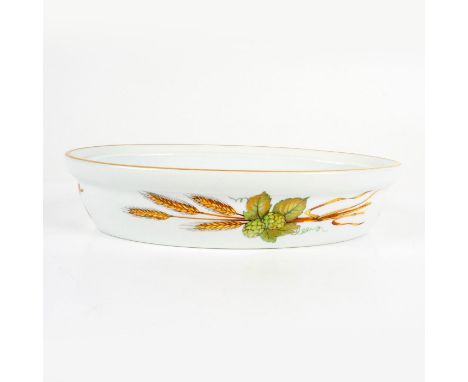 White porcelain decorated with berries and wheat and a gilded rim. Royal Worcester backstamp. Dimensions: 10.5"L x 7"W x 2.25