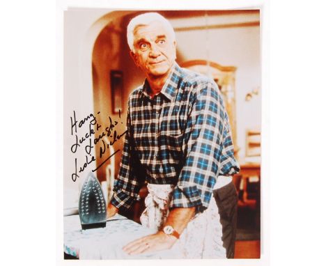 A rare 8x10" colour photograph of Leslie Neilson (Naked Gun, Police Squad etc) signed by Neilson in black marker to a light p