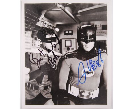 A vintage black and white 8x10" photograph from the original Batman 1960's TV Series. Signed by the two stars Adam West &amp;