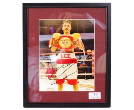Lee Haskins - IBF World Champion Boxer. A signed colour 8x10" photograph by Haskins, showing him with his World Champion belt