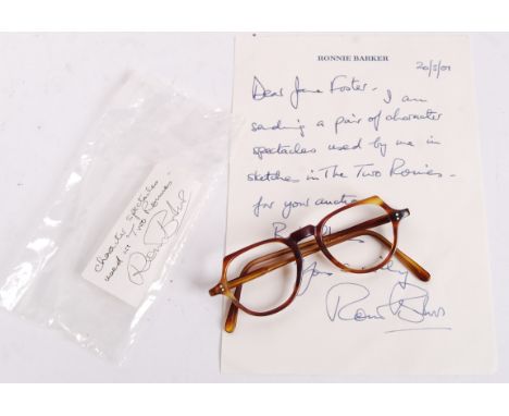 An incredibly rare pair of spectacles owned and worn by Ronnie Barker during many ' Two Ronnies ' television sketches. The pa