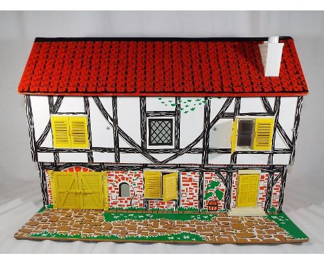 A vintage dolls house with removable roof together with associated dolls furniture