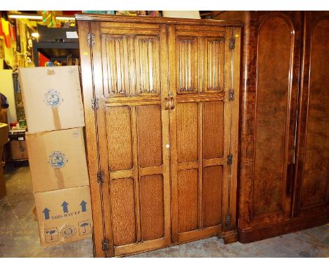 A gentleman's oak wardrobe, the door with lock and key, 183 cm x 120 cm x 47 cm 