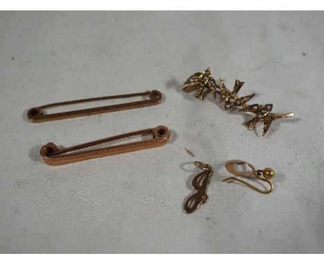 A lady's hallmarked 9 carat gold bar brooch depicting swallows set with pearls, two gentleman's 9 carat gold tie-pins and a s