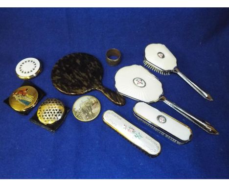 A good mixed lot to include a tortoiseshell hand mirror, vanity set, a silver hallmarked and horn napkin ring, vintage powder