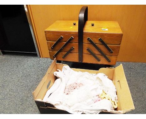 A vintage wooden cantilever sewing box with a small collection of vintage linen (2)