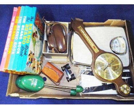 A good mixed lot to include a barometer, opera glasses, a Taron vintage camera, a small quantity of The Beano children's annu