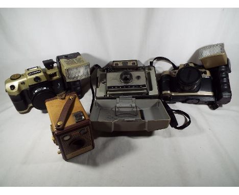 A collection of 4 vintage cameras, to include a Polaroid 320 Automatic Land camera, 2 Olympia cameras with cases, and a Kodak