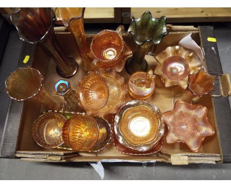 A collection of approximately 20 pieces of carnival glass to include vases, trinket dishes, desert dishes, a lidded trinket d