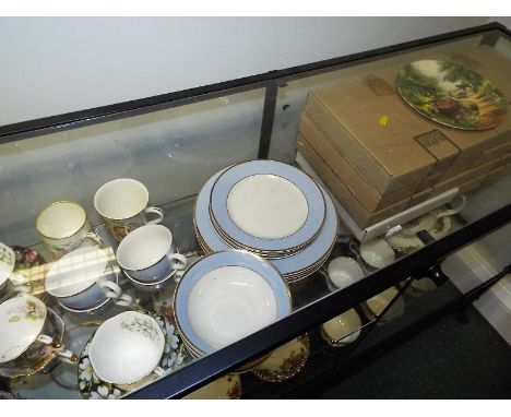 A Doulton tea service, four place setting comprising twenty pieces, a further small selection of Royal Albert decorated in th