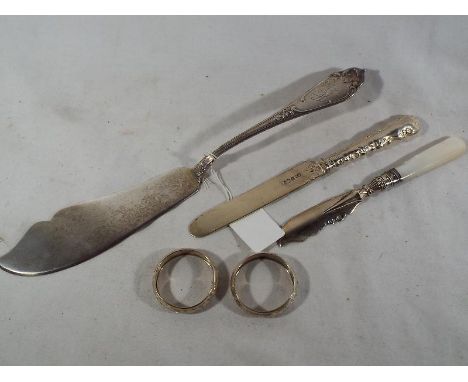 A collection of silver comprising a large German fish knife stamped .800, a dessert knife, Sheffield assay 1936, a butter kni