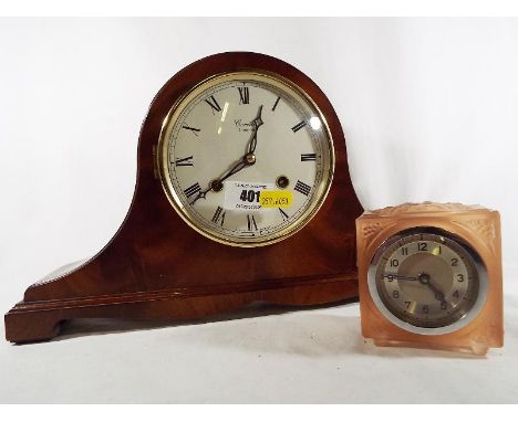 A modern mahogany cased mantel clock by Comitti, Roman numerals on a white dial, mechanical movement, striking the hour and h