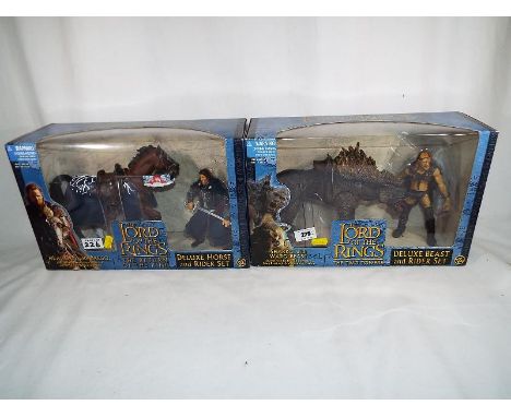 Lord of the Rings - two Lord of the Rings mint in box figures to include The Two Towers deluxe beast and rider set Sharku wit