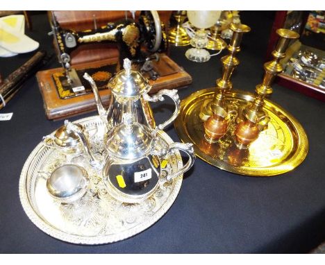 A good quality plated tea service with serving tray and a brass serving tray, candlesticks and copper and brass ornamental ju