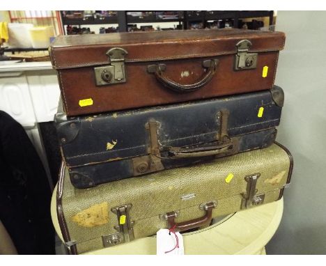 Three vintage suitcases