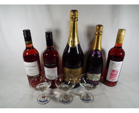 A 150 cl bottle of premium sparkling perry, Chaumet, a Jacquart bottle of champagne, three bottles of wine and three Babysham