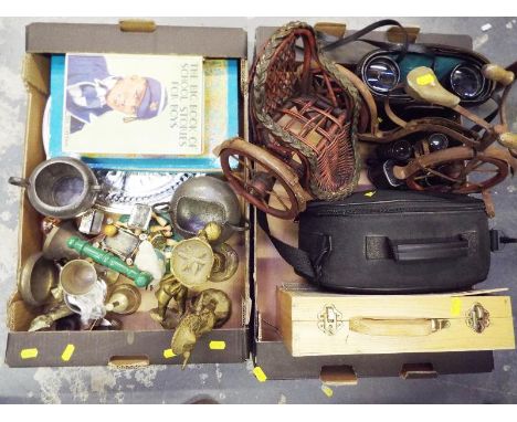 Two boxes containing a mixed lot of metalware to include brass ornaments, trinket boxes, serving tray, hand bells, an ornamen