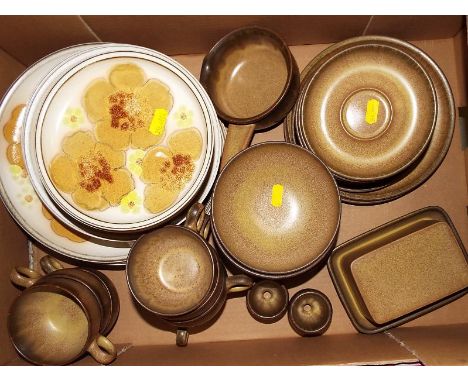 A collection of approximately 40 pieces of Denby tableware to include dinner plates, side plates, bowls, cups, saucers, butte