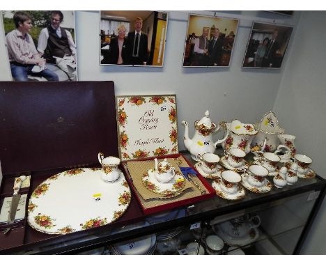 A collection of approximately 18 pieces of  Royal Albert Old Country Roses tea service with cake stand and cake plate and a s