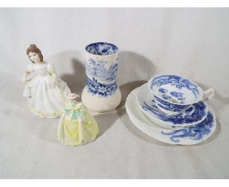 A Royal Doulton ceramic lady figurine, a Coalport ceramic figurine entitled Spring Line, a Royal Doulton trio and a Minton va