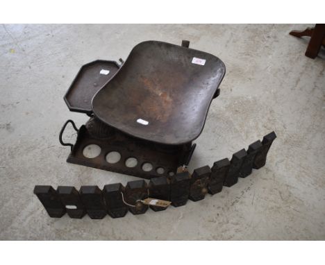 A cast fire front and a set of similar balance scales