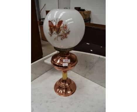 A traditional copper and brass oil lamp with clear chimney and opaque shade. Height approx 55cm (to top of chimney)