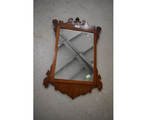 A Chippendale style wall mirror having silver back