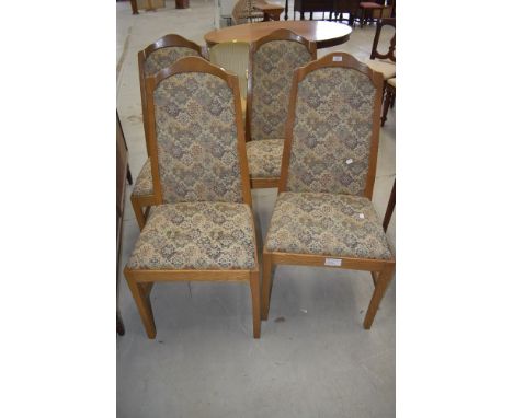 A set of four light oak dining chairs in a light oak by Parker Knoll