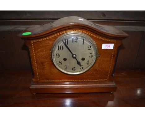 A mahogany cased mantle clock having inlayed banding and chime