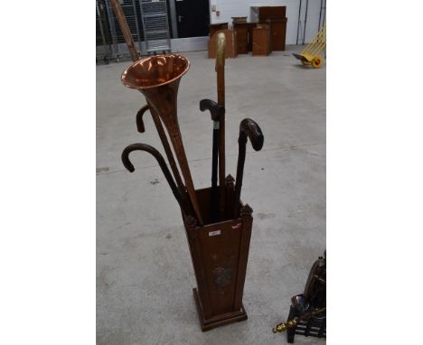 A vintage stick stand and contents, including copper horn