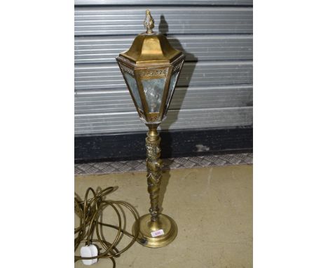 An early 20th Century brass table lamp having streetlight style top on totem column , height approx. 60cm