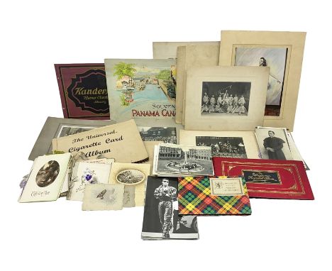 Two albums of cigarette cards, including Carreras Alice in Wonderland examples, together with vintage greetings cards, postca